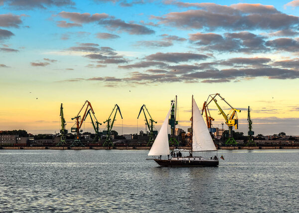 Klaipeda, Lithuania - August 22, 2017: Evening view on Klaipeda Port, yacht and Curonian Lagoon