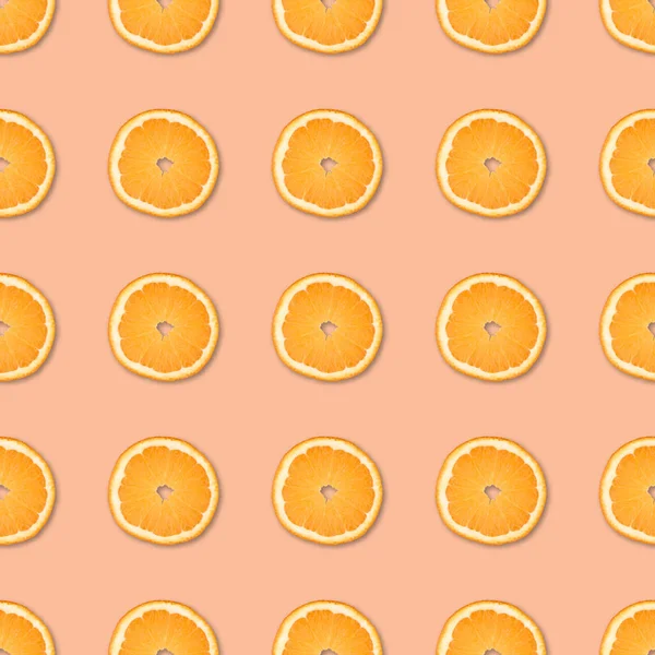 Fresh orange slices seamless pattern. Close up of citrus fruit on orange background. Studio photography.