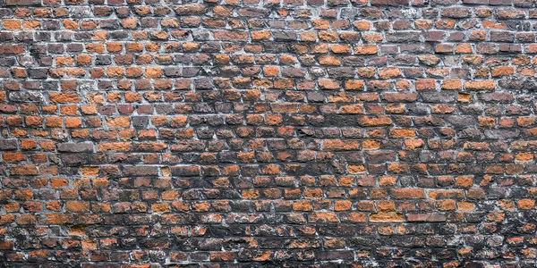 レンガの壁、赤と灰色の石積みの広いパノラマ. — ストック写真
