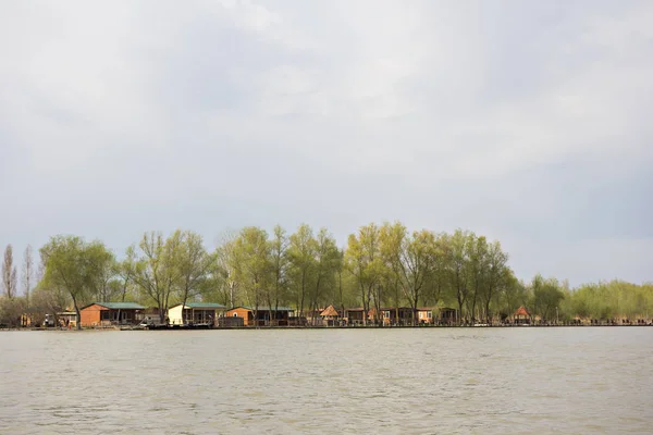 Houses on the river bank. Rest house, hotel on the river bank.