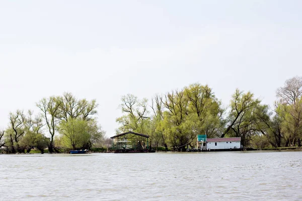 Houses on the river bank. Rest house, hotel on the river bank.