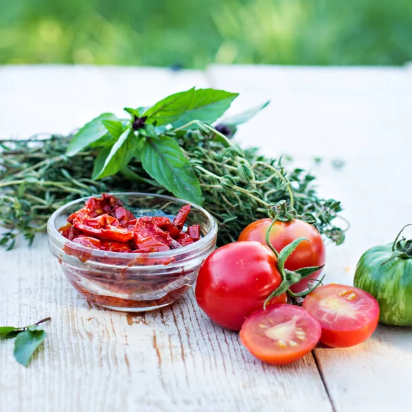 Sun-dried tomatoes and aromatic herbs. Sun dried tomatoes with herbs and sea salt