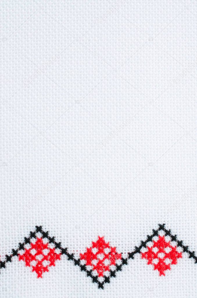 Element Handmade Embroidery on White Linen by Red and Black Cotton Threads. Design of Ethnic Textures. Pattern Craft Embroidery By Cross Stitch. Background With Embroidery. Geometric Folk Ornament.