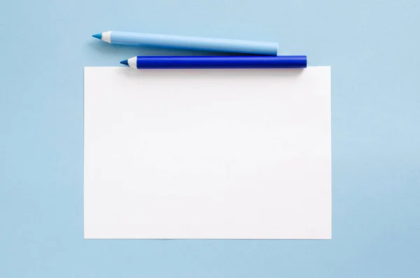 White Blank Sheet Paper Two Blue Pencils Mock Copy Space Royalty Free Stock Photos