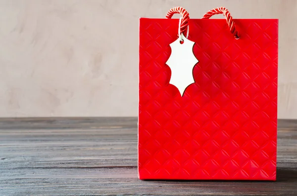 Mock-up of blank craft package, mockup of red paper shopping bag. Copy space for your logo. Holiday shopping. Christmas presents