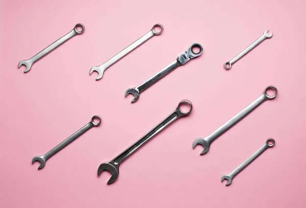 A few wrenches on a pink background. — Stock Photo, Image