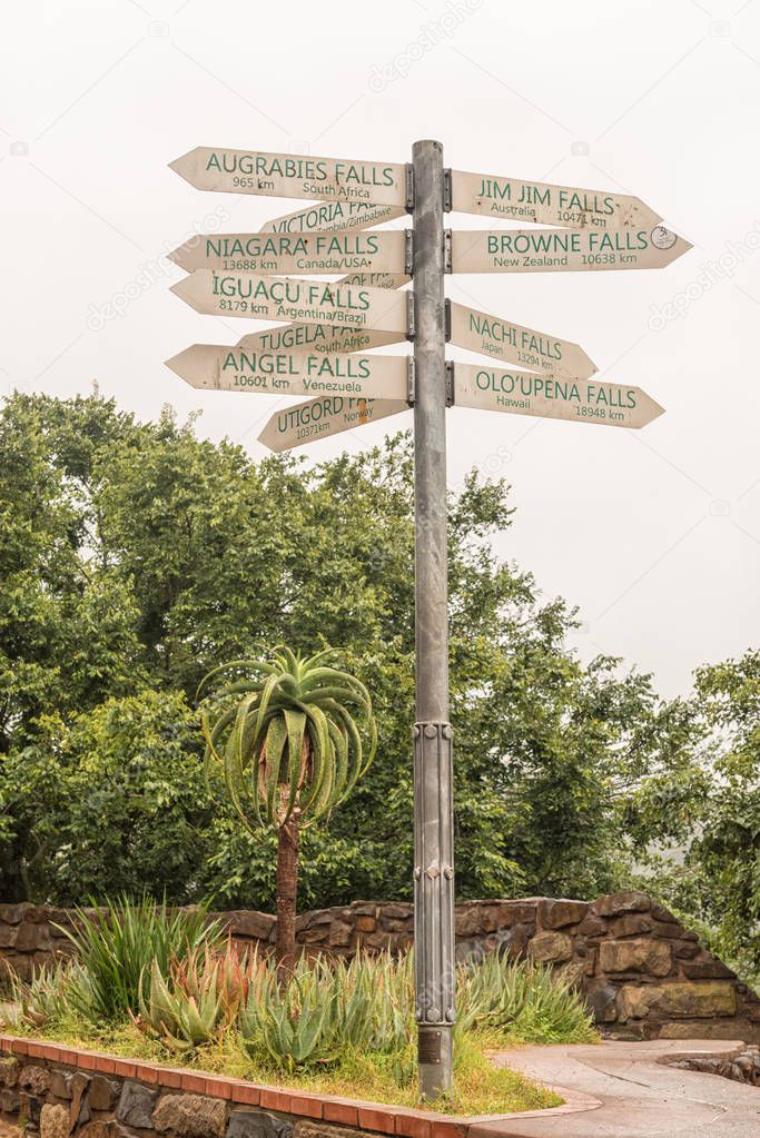 A signpost, showing the distances to famous waterfall of the world, at the Howick Falls, in Howick, in the Kwazulu-Natal Midlands Meander