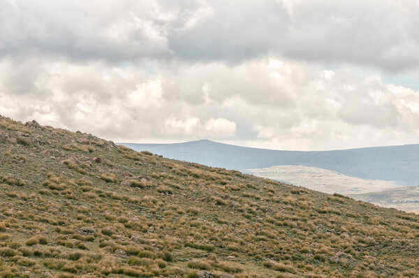 Thabana Ntlenyana, the small peak in the distance, is at 3482 m the highest point in Southern Africa. Seen from the top of Black Mountain Pass in Lesotho