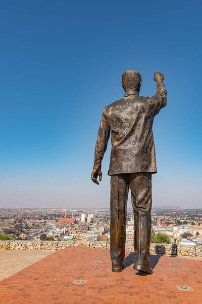 BLOEMFONTEIN, SOUTH AFRICA, JUNE 27, 2018: The 6.5m bronze statue of Nelson Mandela on Naval hill guarding over Bloemfontein