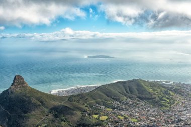 CAPE TOWN, SOUTH AFRICA, AUGUST 17, 2018: Lions Head, Signal Hill, Robben Island and part of Cape Town as seen from the top of Table mountain clipart