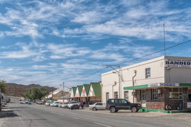 WILLISTON, SOUTH AFRICA, AUGUST 31, 2018: A street scene, with vehicles, people and businesses, in Williston in the Northern Cape Province