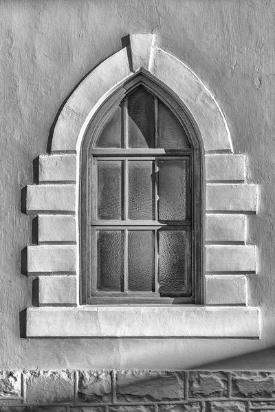 A Neo-Gothic architectural style window in Victoria West in the Northern Cape Province. Monochrome