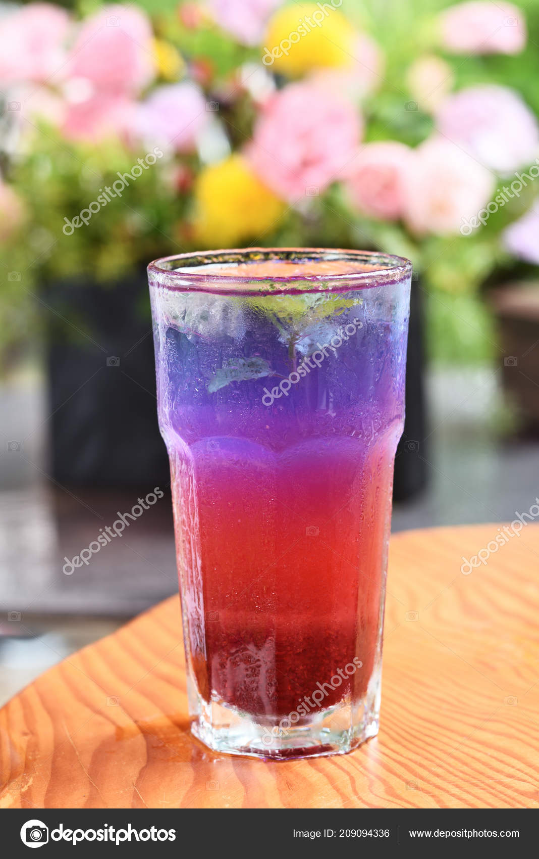 Butterfly Pea Flower Iced Tea Glass Wooden Table Stock