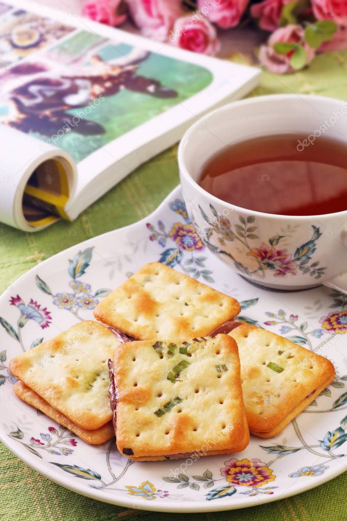 Scallion cookie nougats with tea on the plate