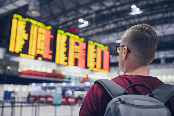 Rear View Young Man Checking Flight Schedule Arrival Departure Board — Stock Photo, Image