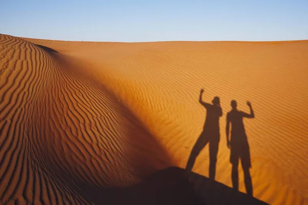 Shadows Two Friends Waving Greeting Sand Dunes Oman Desert — Stock Photo, Image