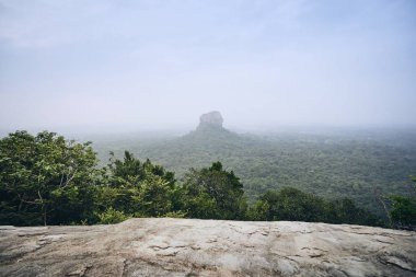 Sigiriya Rock (UNESCO World Heritage Site). View from Pidurangala Rock in Sri Lanka. clipart