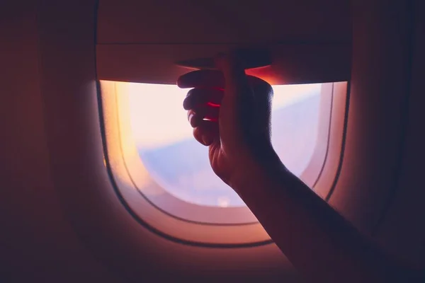 Close-up airplane window at sunrise — Stock Photo, Image