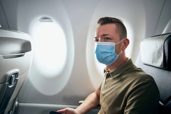 Man Wearing Face Mask Airplane Flight Themes New Normal Coronavirus — Stock Photo, Image