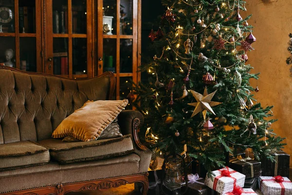 Christmas tree in room with sofa