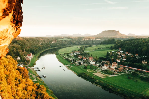 Aerial view of Elbe river and houses of Rathen village, Elbe Sandstone Mountains, Saxony, Germany