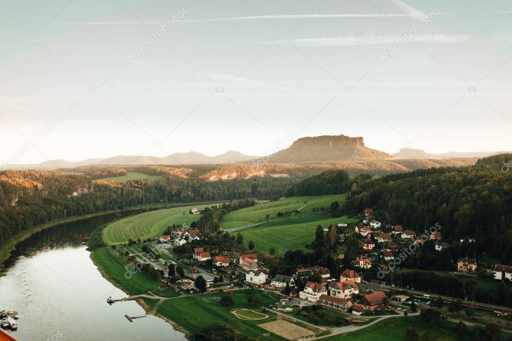 Aerial view of Elbe river and houses of Rathen village, Elbe Sandstone Mountains, Saxony, Germany