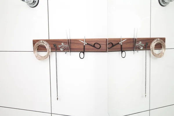 Shower cabin magnet panel with scissors, pins, tweezers and thread