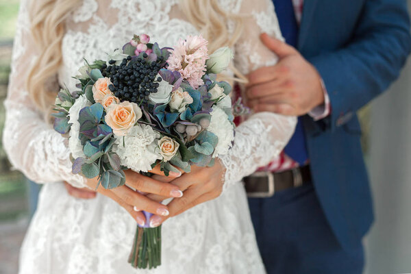flowers in their hands. wedding