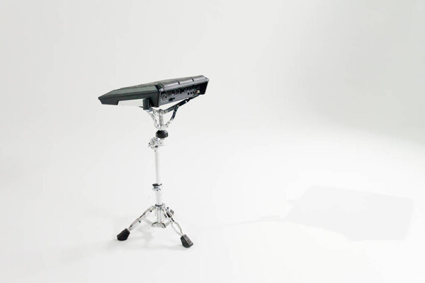 Electronic drum ped on a white backgroun