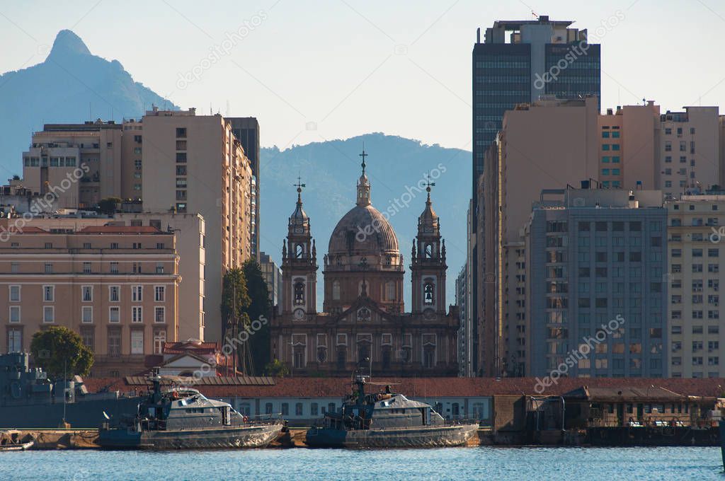 View of Rio de Janeiro Downtown With Candelaria Church and Marine Ships in Water with Mountains on Background
