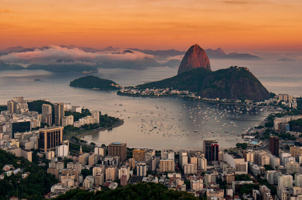View of Favela Rocinha at sunrise with Ipanema district in Rio de Janeiro, Brazil