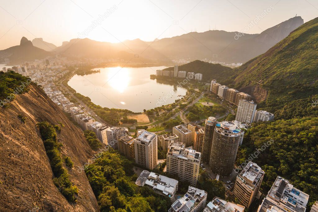 Beautiful View of Rodrigo de Freitas Lagoon by Sunset Surrounded by Apartment Buildings and Mountains in Rio de Janeiro, Brazil