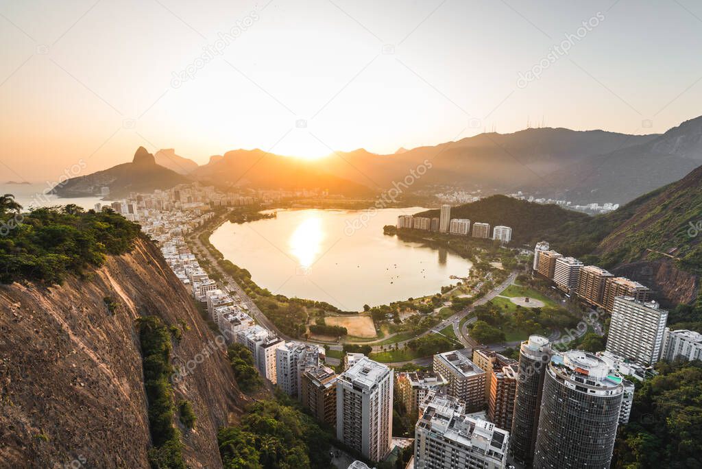 Beautiful View of Rodrigo de Freitas Lagoon by Sunset Surrounded by Apartment Buildings and Mountains in Rio de Janeiro, Brazil