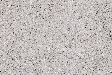 Granit mozaik desen, beton zemin arka planı. Beton dokusunda beyaz granit taşlar var.