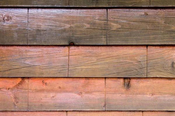 Wood texture. Decorative wooden bricks. The medieval wall. Mahogany wood, walnut.