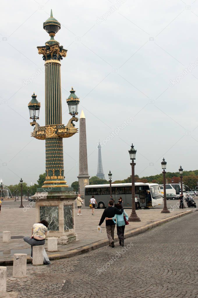 A visual row a perspective of the sacral column of the Egyptian obelisk and the Eiffel Tower view from the Place de la Concorde in Paris.