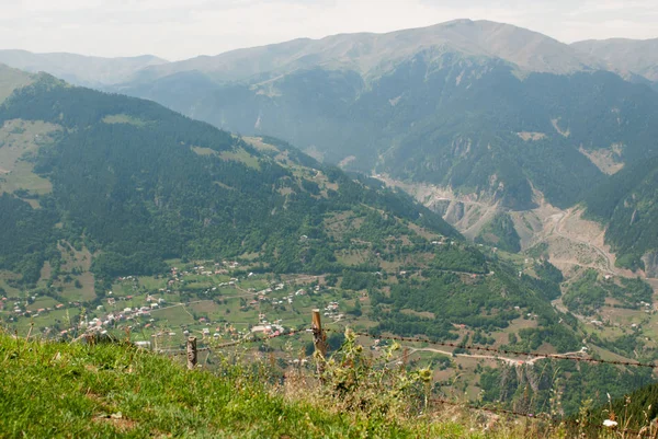 View of the city in a mountain valley and the roads on the mountain slopes through key wire in Turkey