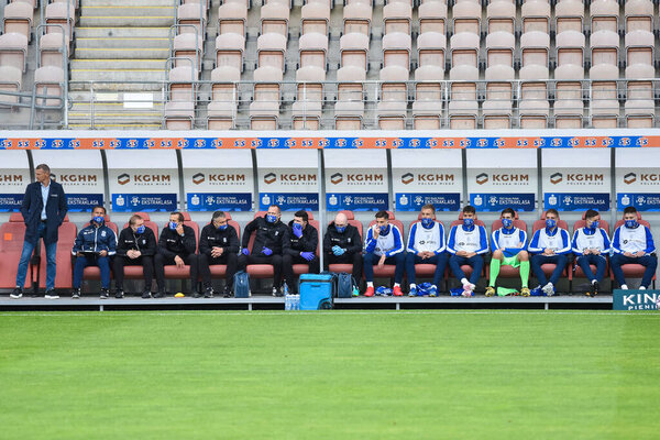 LUBIN, POLAND - JUNE 6, 2020: Match Polish football top league PKO Ekstraklasa between KGHM Zaglebie Lubin vs Lech Poznan 3:3.Head coach of Lech Dariusz Zuraw (L) and staff and substitutes on the bench.