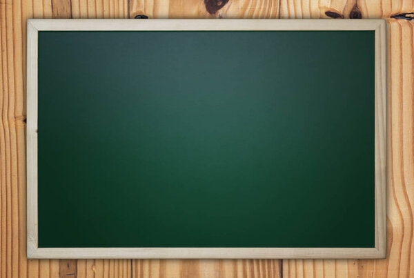Blackboard/Chalkboard on Wooden Background