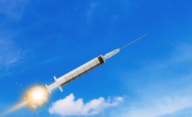 Mavi gökyüzü arka planı, tıbbi ve sağlık konsepti üzerine şırınga ya da iğne fırlatma