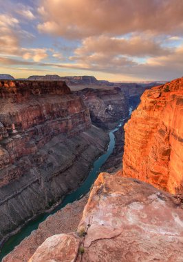 Colorado river runs through the depth of Grand Canyon clipart