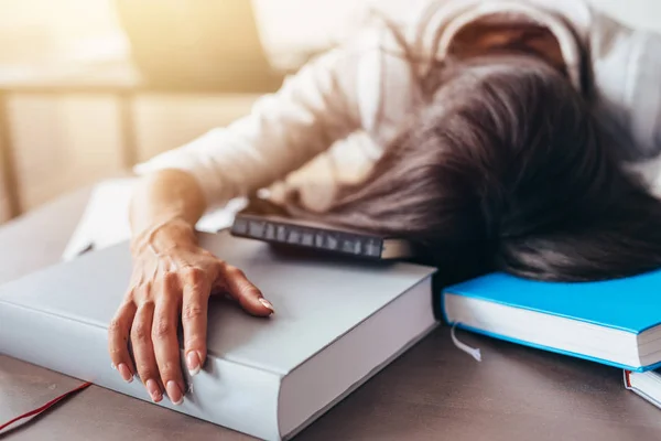 Portrait of tired and tortured female student sleeping on the table — Stock Photo, Image