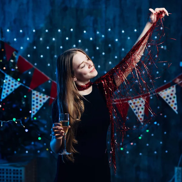 Girl playing with red tinsel Christmas New Year. — Stock Photo, Image