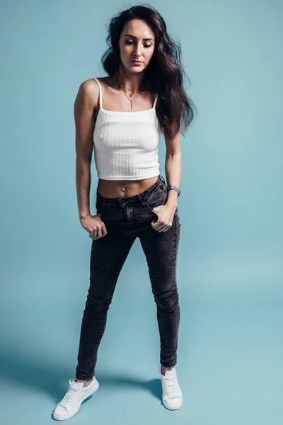 Young woman with perfect body posing in studio — Stock Photo, Image