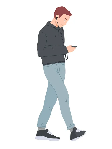 Młody człowiek chodzenie i patrząc w smartphone. — Wektor stockowy