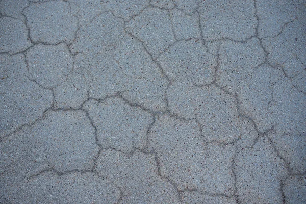 Surface of grey cracked asphalt. Tarmac, road. Texture Background, Top view. — Stock Photo, Image