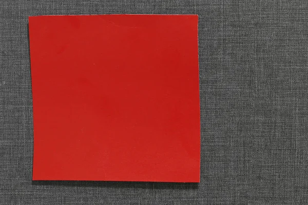 empty red art paper on a black wooden floor for design in Christmas concept.