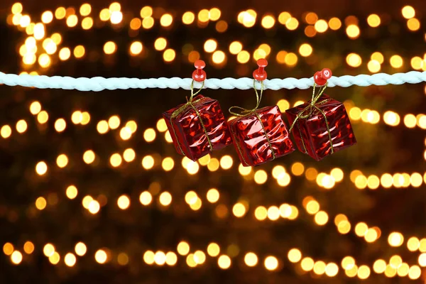 Red Gift Box Hanging Clothesline Bokeh Background Design Your Christmas — Stock Photo, Image