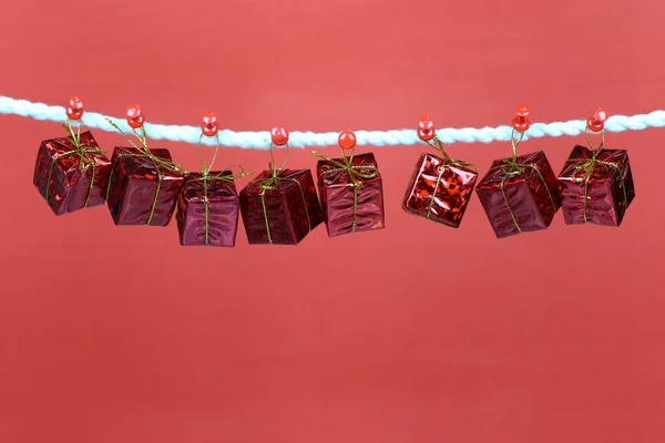Red Gift Box Hang Clothesline Have Copy Space Red Background — Stock Photo, Image