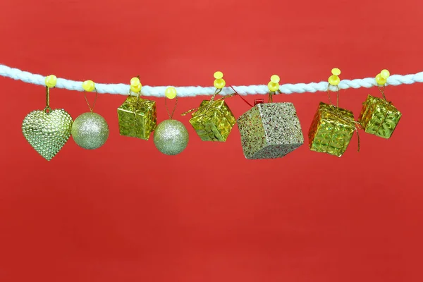Gold Gift Box Hang Clothesline Have Copy Space Red Background — Stock Photo, Image